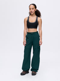 Model wearing RecTrek Cargo Pant in Forest Green, featuring utility pockets and a relaxed fit.