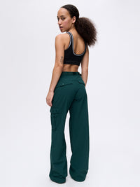 Back view of model wearing RecTrek Cargo Pant in Deep Teal with utility-style pockets and relaxed fit.