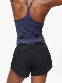 Back view of Relay 3" Short in Black, featuring an elastic waistband for active movement.