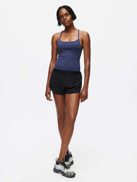 Model standing in Relay 3" Short in Black, featuring a lightweight and unlined design.