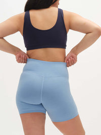 Back view of Echo 5.5" Short in Cotton Candy, featuring a tall waistband for gentle support.