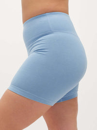 Side view of Echo 5.5" Short in Cotton Candy, featuring a tall waistband for gentle hold.