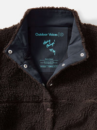 Interior view of Candy Fleece Snap Jacket in Dark Brown, featuring breathable mesh lining and Oversized main label.