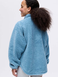 Back view of Candy Fleece Snap Jacket in Light Blue, with its cozy brushed fabric and oversized fit.