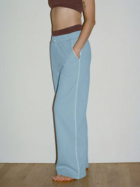 Side view of Sport Sweatpant in Light Blue, featuring a comfortable nylon waistband and pockets.