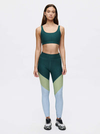 Model standing in Springs 7/8 Legging with 3-tone paneling, paired with a matching crop top for active comfort.