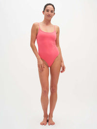 Model standing in Strappy Bodysuit in Cotton Candy, featuring adjustable spaghetti straps and a feminine neckline.