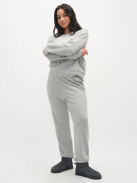 Model wearing Stratus Sweatpant in Grey, relaxed fit with a soft and comfortable fabric.