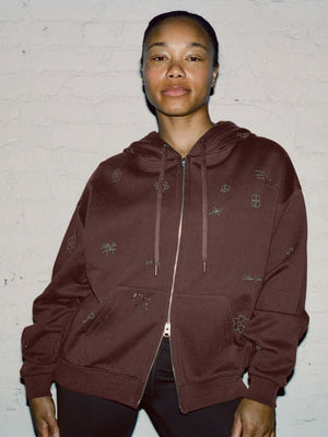 Model wearing Sunny Hoodie in Maroon, featuring a relaxed fit and a 2-way zipper.