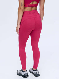 Back view of TechSweat Core 7/8 Legging in Raspberry, featuring an engineered waistband for a secure fit.