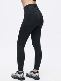 Model from the back wearing TechSweat Core 7/8 Legging in Black with a supportive waistband, ideal for high-intensity workouts.