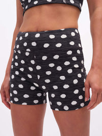 Close-up view of TechSweat 3.5" Short in Black with white polka dots, designed for active movement and comfort.