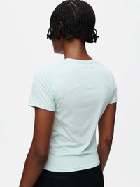 Back view of ThinkFast Jersey Baby Tee in Light Blue, showing the breathable cooling tech detail.