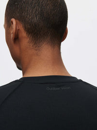 Back view of ThinkFast Mesh Shortsleeve in Black, showing the smooth neckline and breathable fabric.