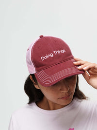 Trucker Hat featuring Doing Things text, for casual outings and making a statement.