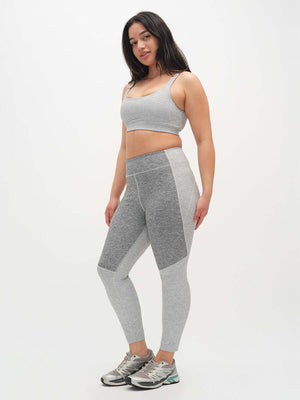 Model posing in Two Tone 7/8 Legging, featuring a stylish two-tone design and a smooth fit, ideal for activewear.