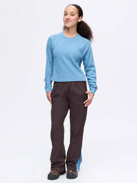 Model smiling in Waffle Longsleeve in Sky Blue, with the soft waffle knit and relaxed fit for everyday wear.