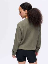 Back view of Waffle Longsleeve in Olive, with the boxy fit and textured waffle knit fabric.
