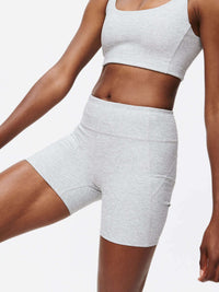 Model wearing Warmup 5" Short in textured compression fabric, for workouts and easy movement.