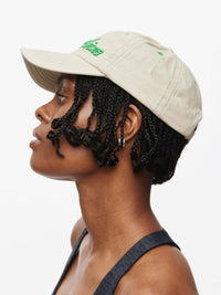 Profile view of a person wearing a Washed Hat made of cotton with Outdoor Voices signature topstitching.