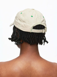 Back view of a person wearing a Washed Hat featuring raised Outdoor Voices signature and topstitching.