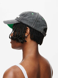 Washed Hat featuring washed cotton and topstitching with Outdoor Voices signature, viewed from the side.