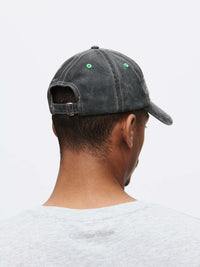 Back view of a man wearing a Washed Hat made of washed cotton with raised topstitching.