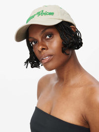 Washed Hat featuring a model wearing a washed cotton cap with Outdoor Voices signature topstitching.