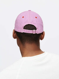 Back view of Washed Hat in Soft Pink, featuring adjustable strap and topstitching details.