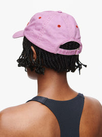 Back view of Washed Hat in Light Pink, washed cotton fabric with topstitching details.