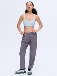 Model standing in Zephyr 26" Pant in Dusty Lavender with a custom-fit drawstring waist, ready for everyday activities.