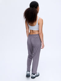 Back view of Zephyr 26" Pant in Ash, featuring a custom-fit drawstring waist for activewear comfort.