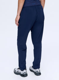 Back view of Zephyr 26" Pant in Navy, featuring a comfortable drawstring waist and breathable fabric.