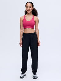 Model wearing Zephyr 29" Pant in Black with custom-fit drawstring waist, styled for activewear.