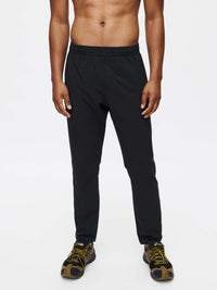 Model standing in black Zephyr Pant with a drawstring waist, ideal for everyday activewear.