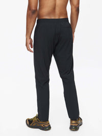 Back view of Zephyr Pant in Black, featuring a custom-fit drawstring waist for comfort.