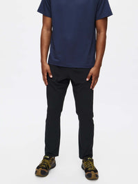 Model wearing Zephyr Pant in Black, featuring a custom-fit drawstring waist and zippered pockets.