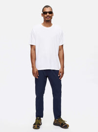 Model wearing Zephyr Pant in Navy with a custom-fit drawstring waist, styled for everyday activities.